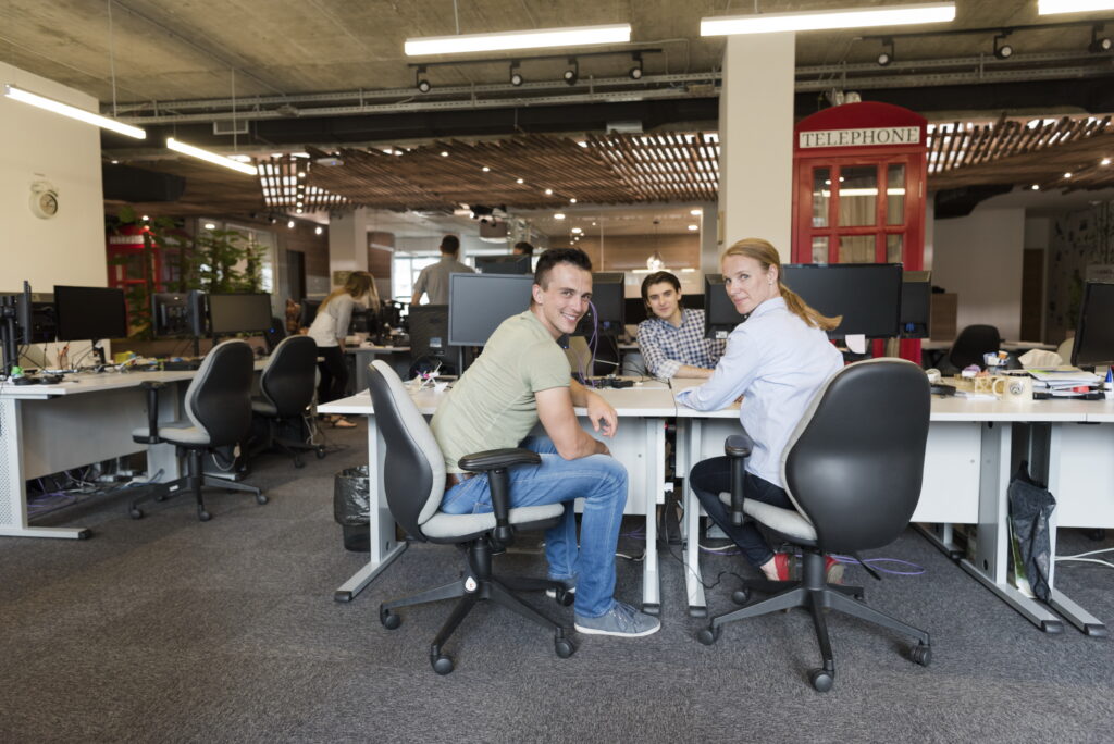 A collaborative office environment where entry-level marketing jobs offer hands-on experience.